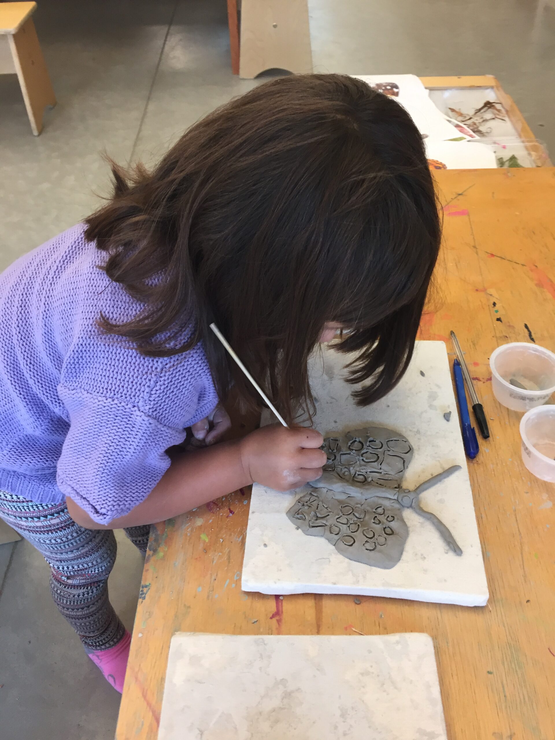 child with clay